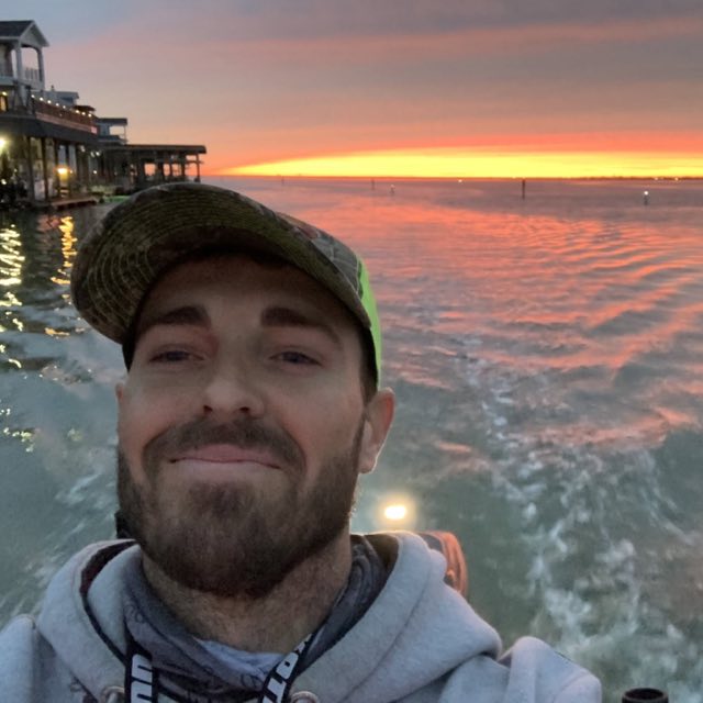 Capt. James on the water at sunset