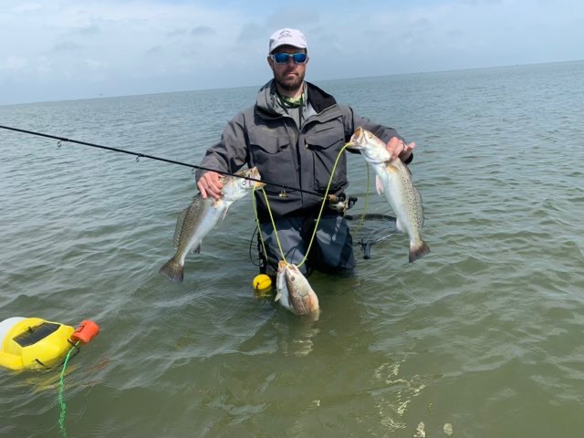 Wading angler with the catch
