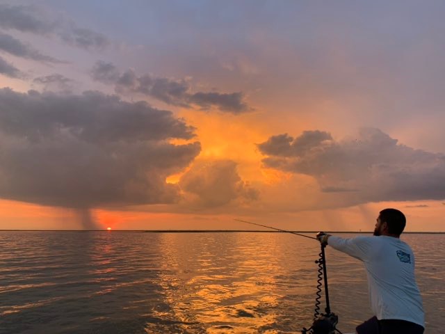 Casting into a fiery sunrise