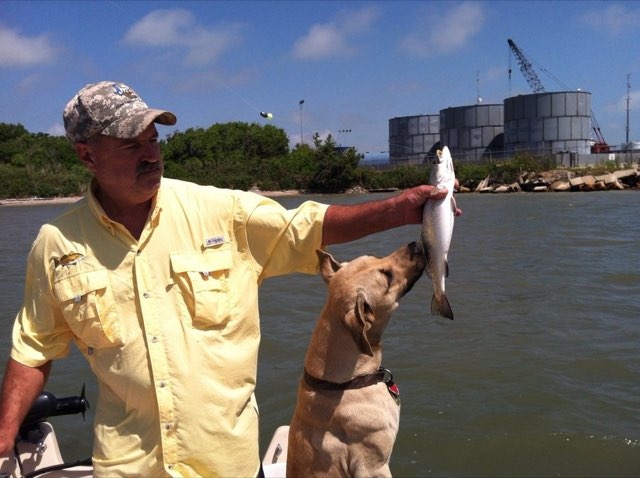 Angler and the boat dog with a speckled trout