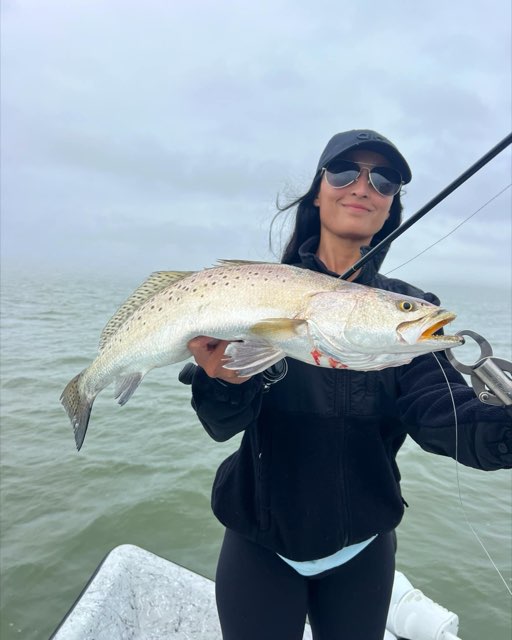 Angler with a big speckled trout
