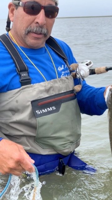 Wading angler on the flats